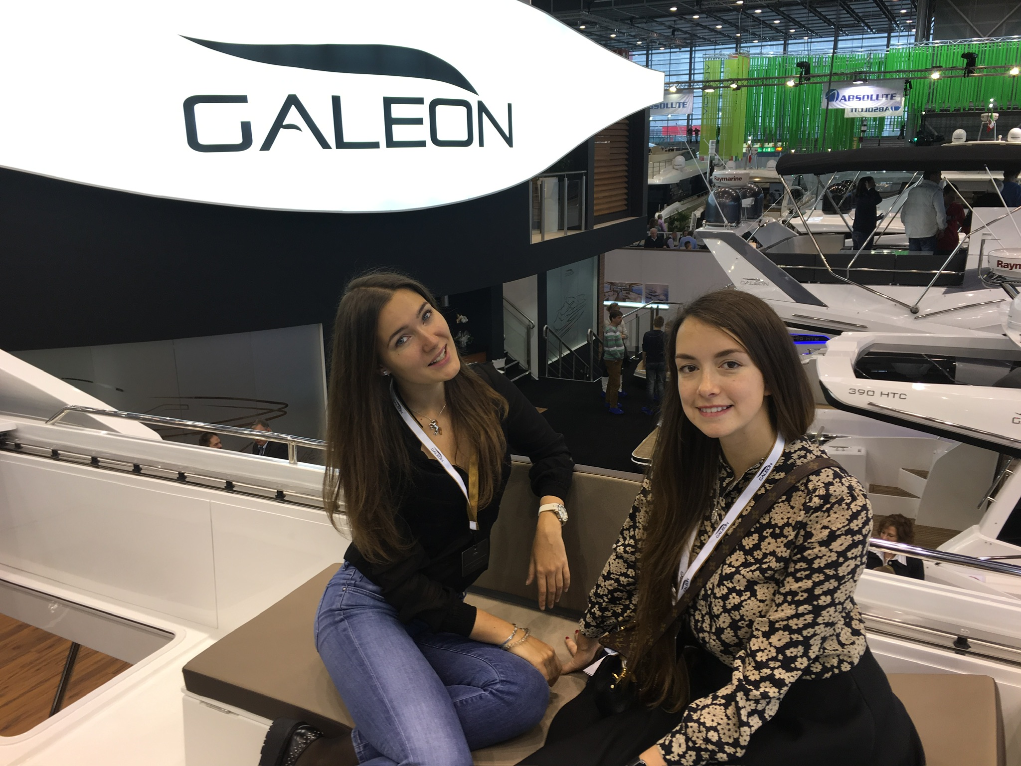 Julia Skop and Maria Razumi at the Galeon stand during a yacht show