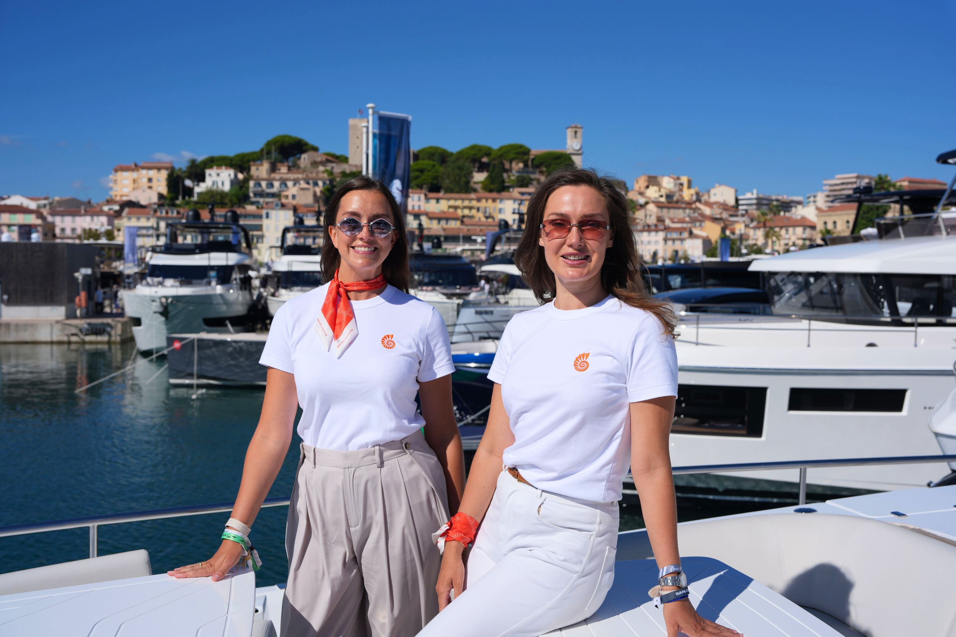 Julia Skop and Maria Razumi aboard a yacht at the Cannes Yachting Festival
